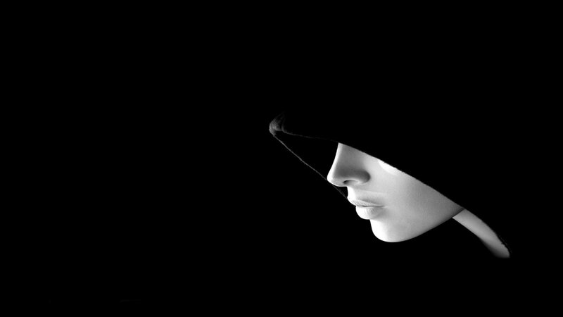woman in hooded silhouette