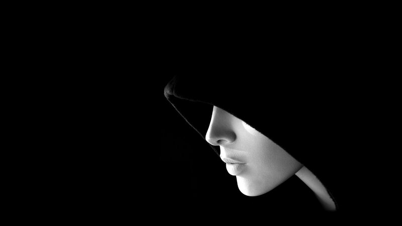 woman in hooded silhouette