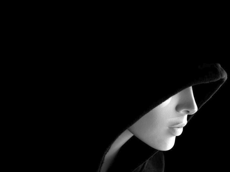 woman in hooded silhouette