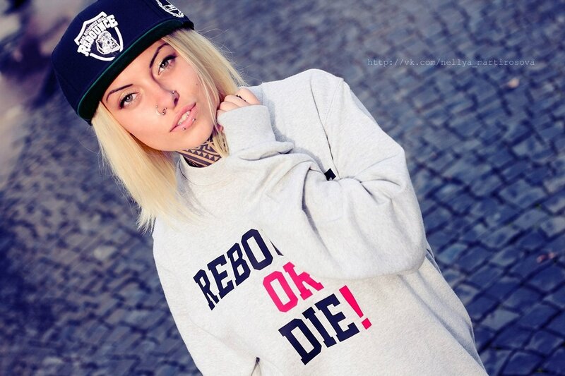 woman in hoodie and cap