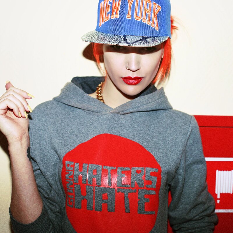 woman in hoodie and cap