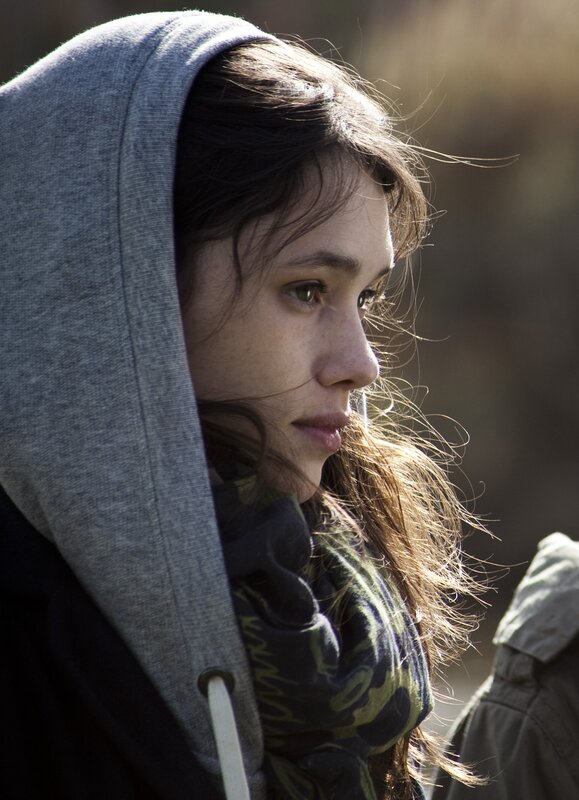woman in hoodie looking away