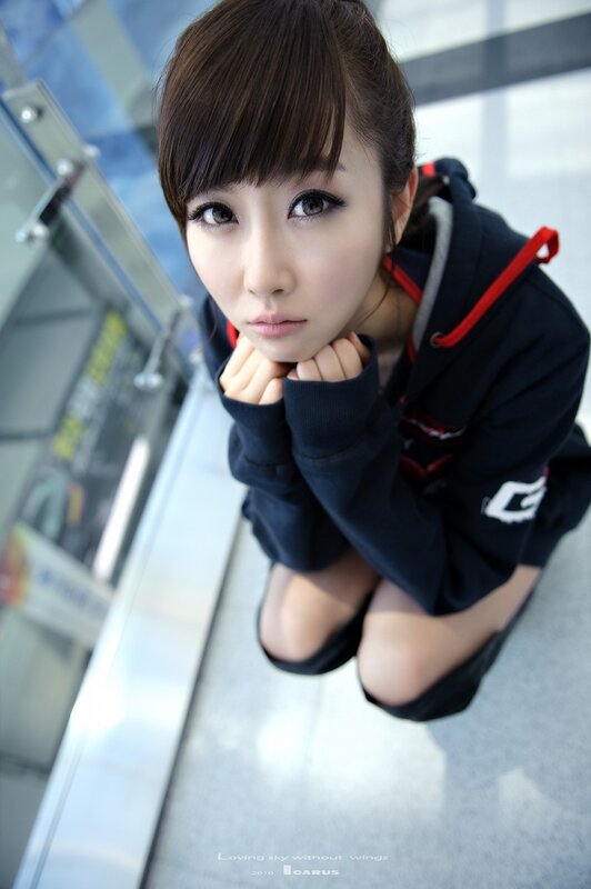 woman in hoodie looking up