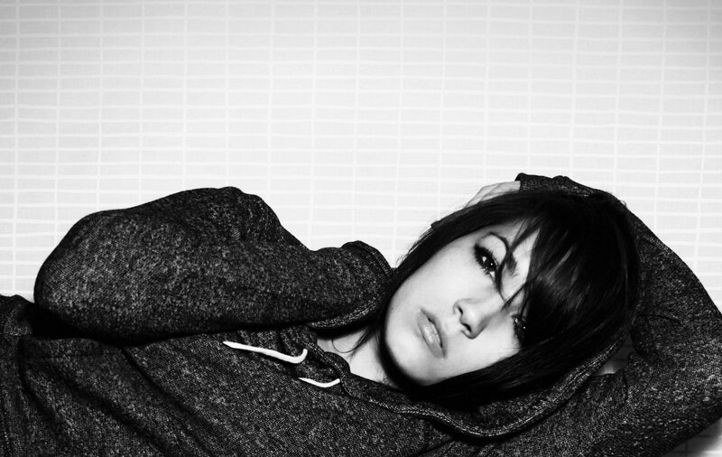 woman in hoodie lying down