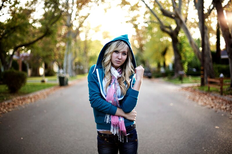 woman in hoodie on a path