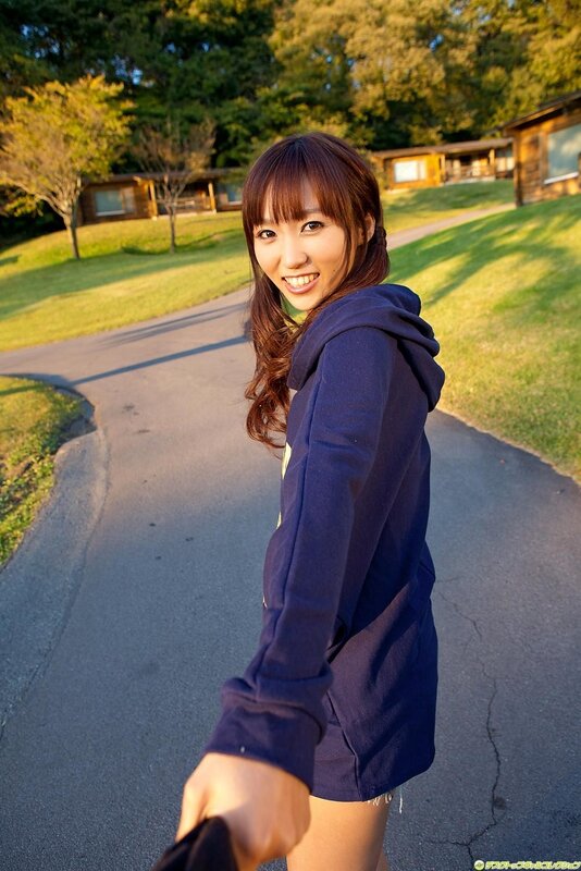 Woman in hoodie on a path