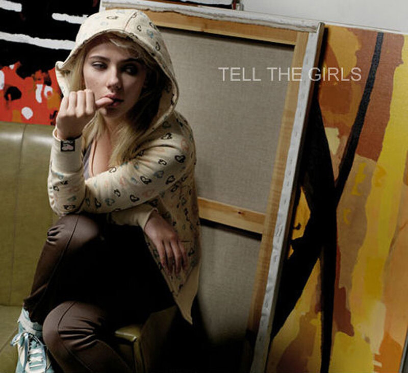woman in hoodie sitting on couch
