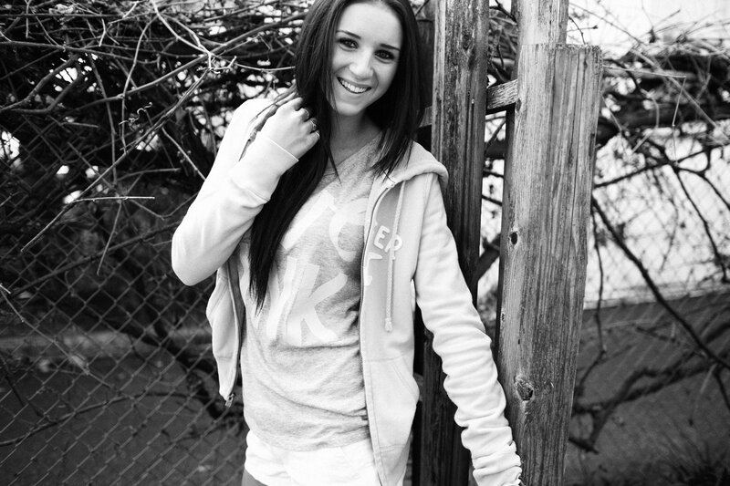 woman in hoodie smiling