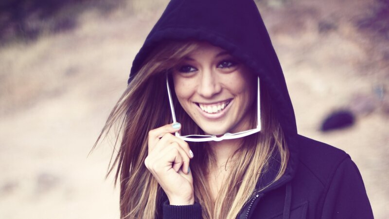 woman in hoodie smiling
