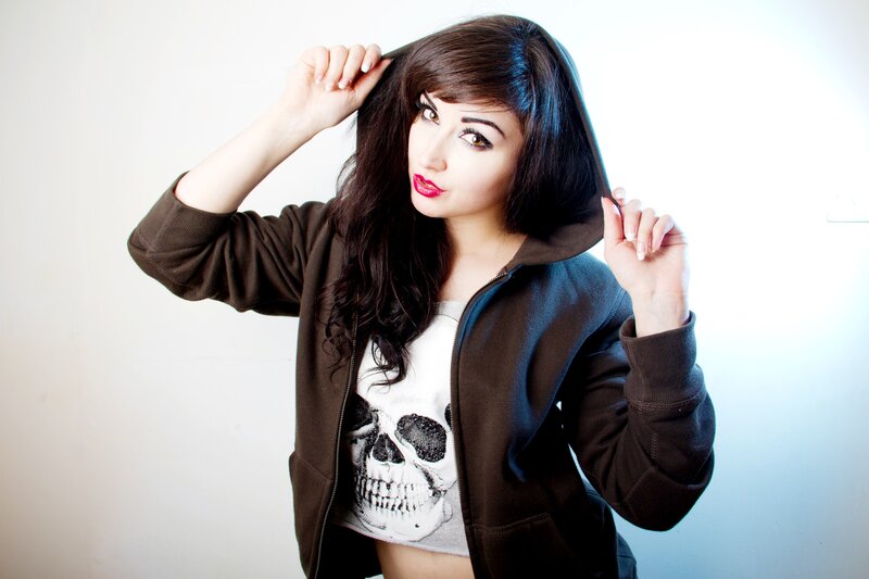 woman in hoodie with skull shirt