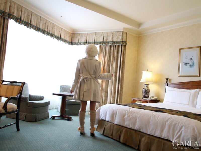 Woman in hotel room