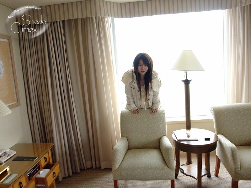 woman in hotel room by window