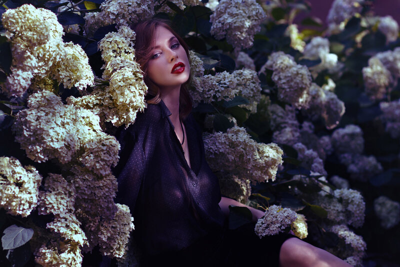 Woman in Hydrangea Bush