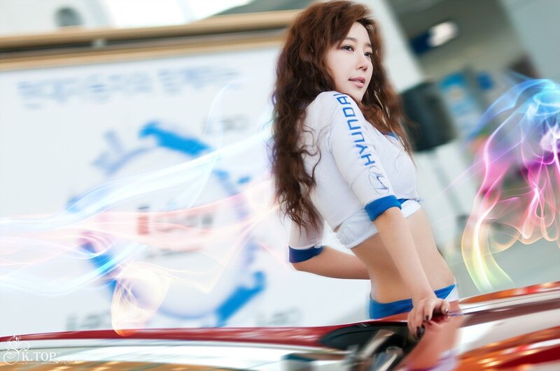 woman in hyundai uniform at car show