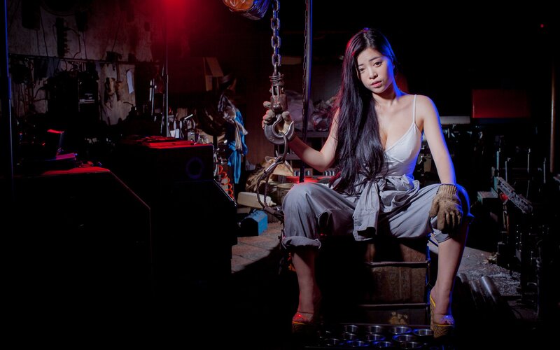 woman in industrial setting with hook