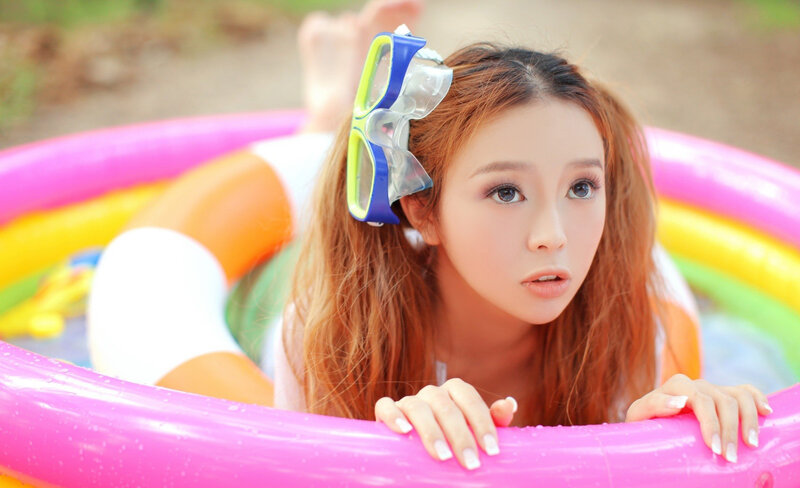 Woman in Inflatable Pool — Pink, Playful, Summer
