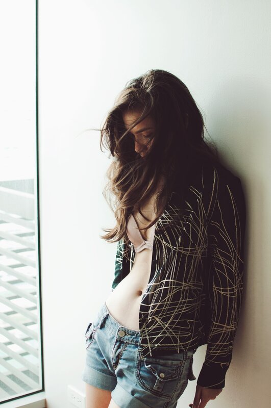 woman in jacket and shorts