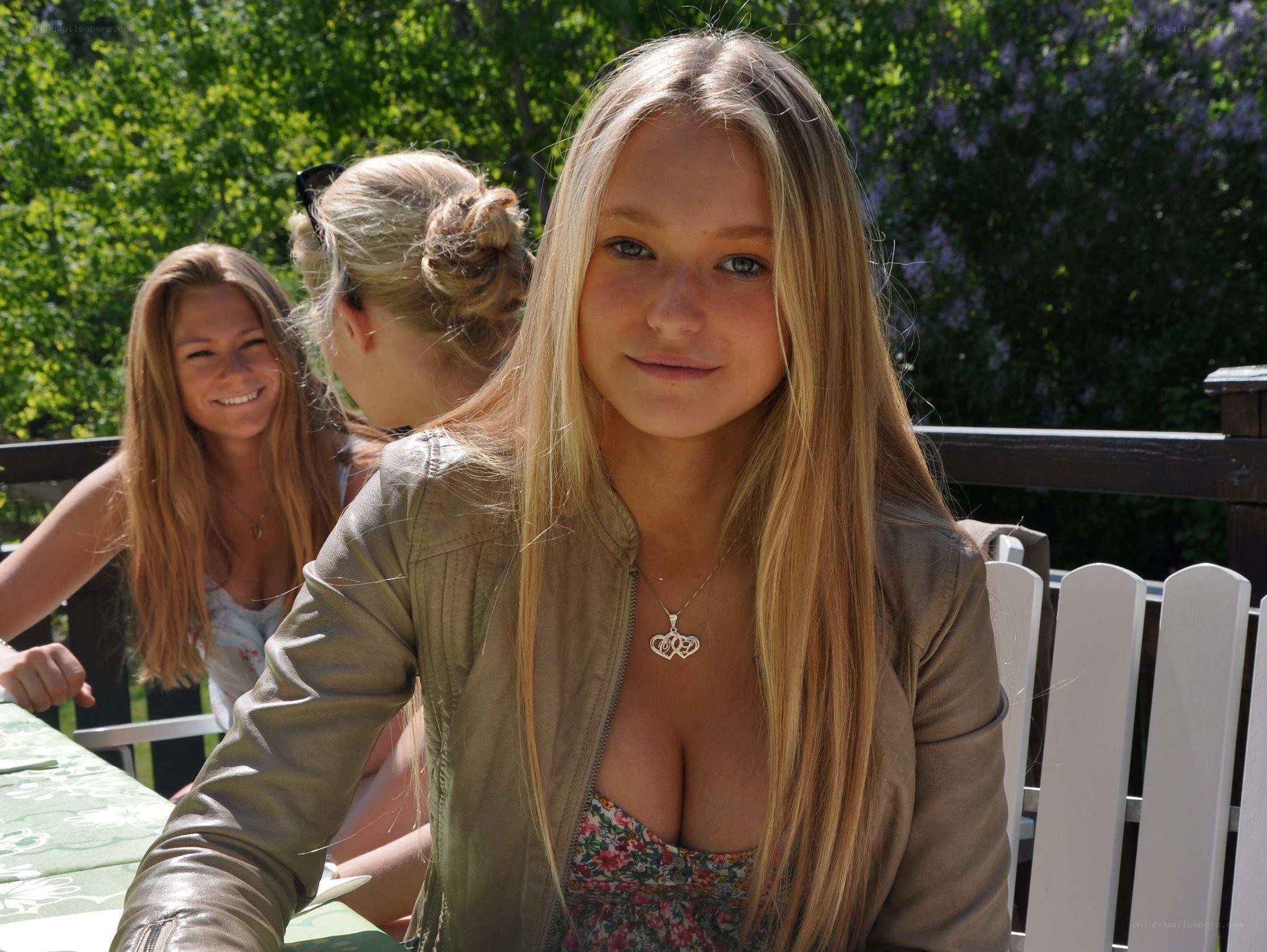 Woman in jacket at outdoor table