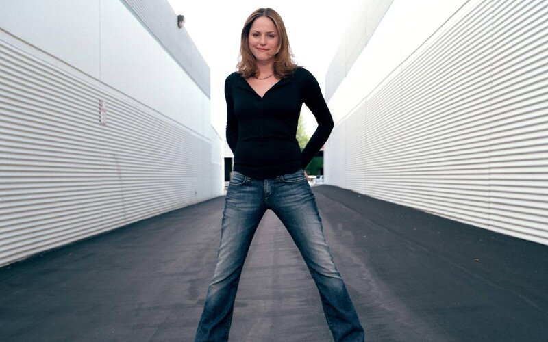 Woman in Jeans and Black Shirt — Blue, Confident