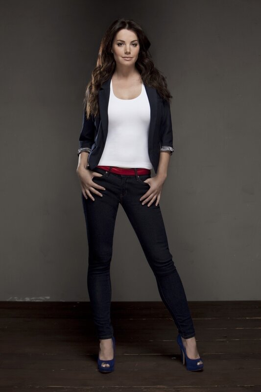 woman in jeans and blazer