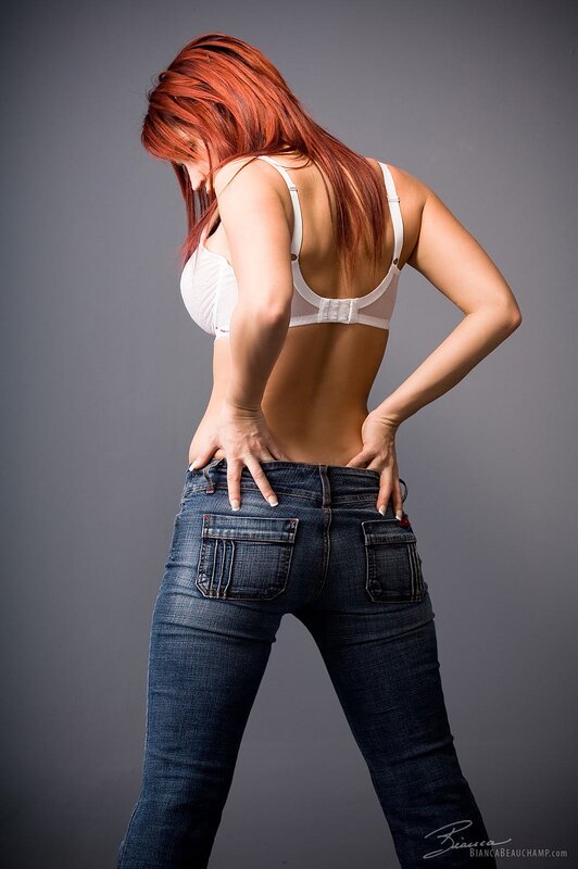 woman in jeans and bra