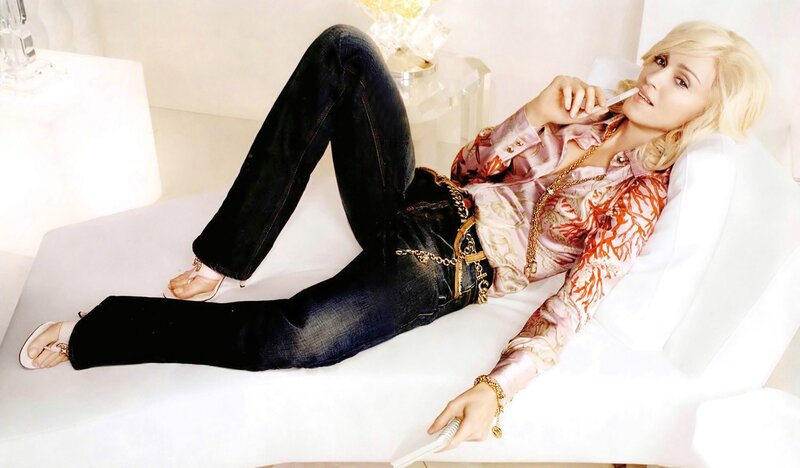 woman in jeans and patterned shirt
