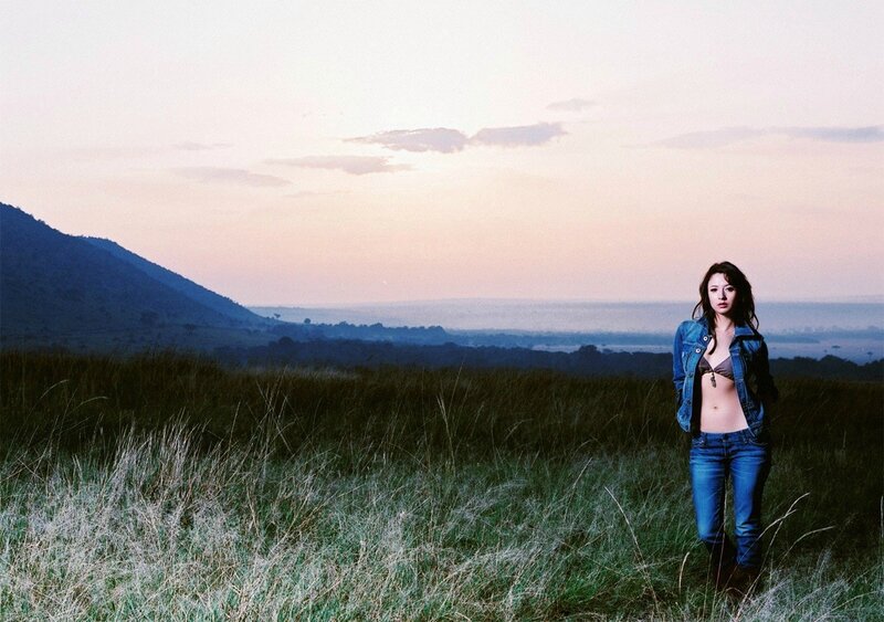 Woman in jeans at sunset
