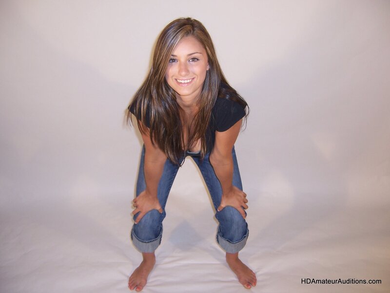 woman in jeans crouching