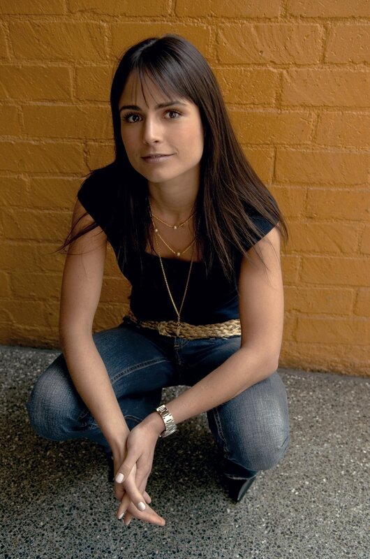 woman in jeans crouching