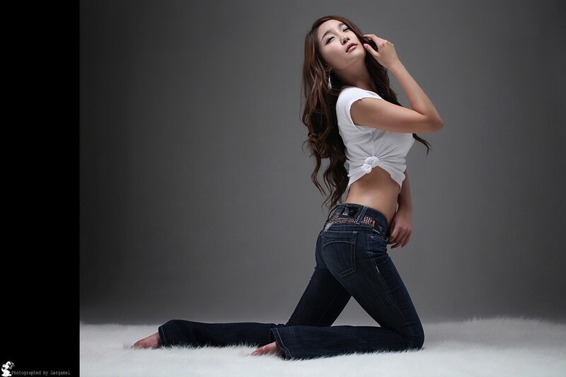 Woman in Jeans Kneeling — Gray