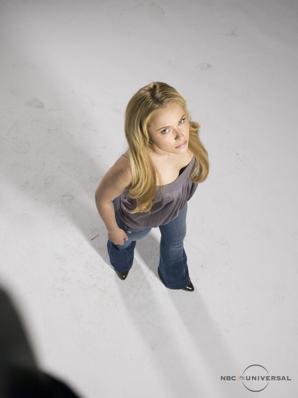woman in jeans looking up