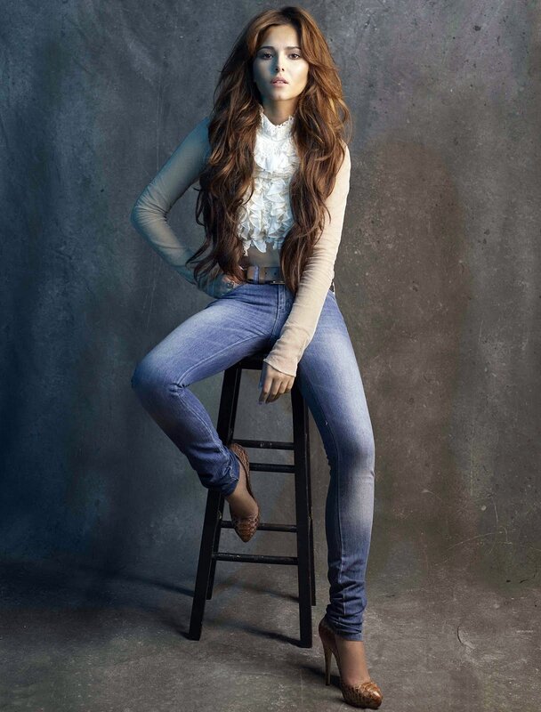 woman in jeans on stool