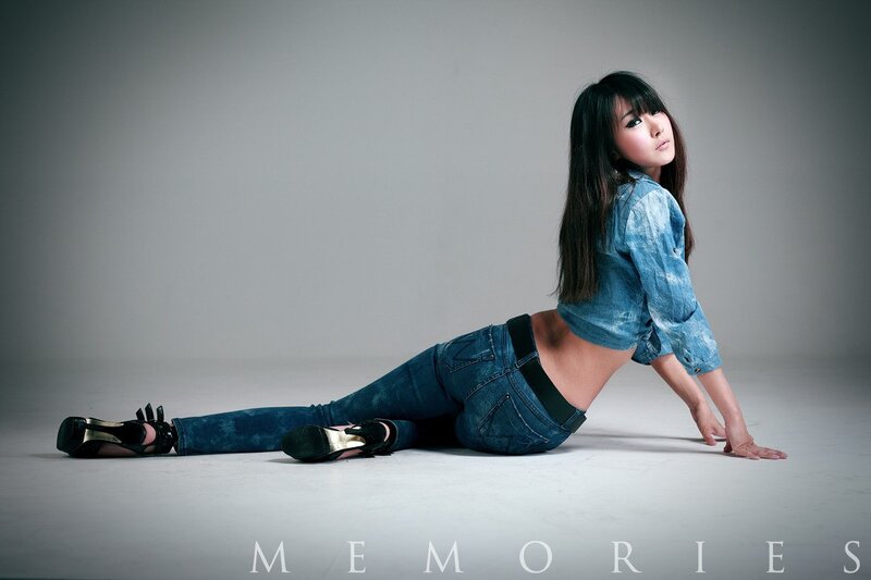 woman in jeans posing on floor