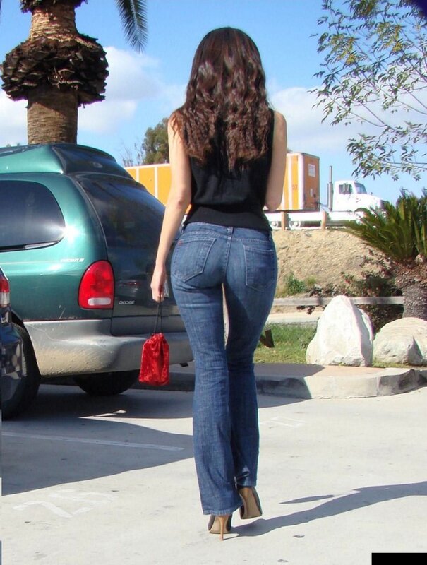 woman in jeans walking away