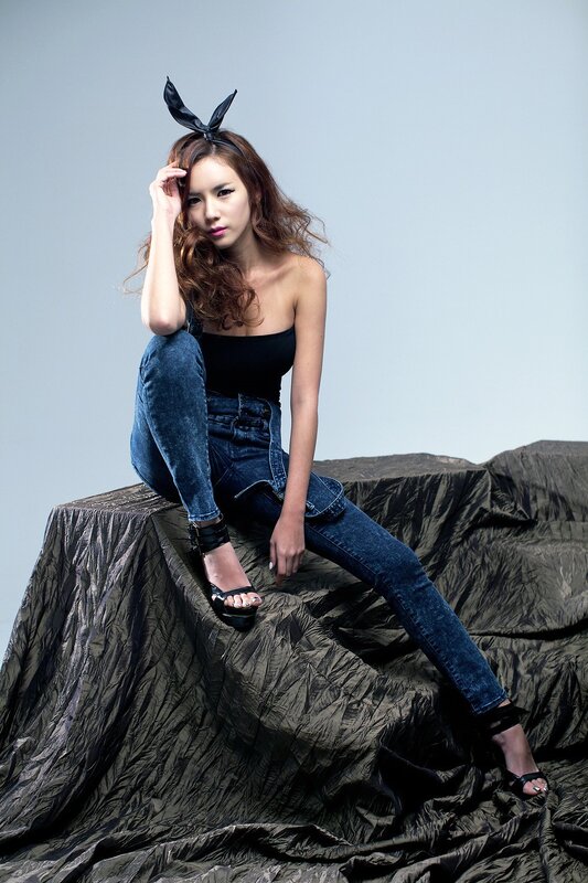 woman in jeans with bunny ears
