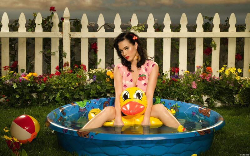 woman in kiddie pool with duck