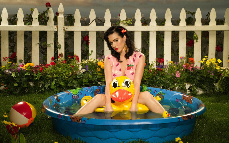 woman in kiddie pool with duck