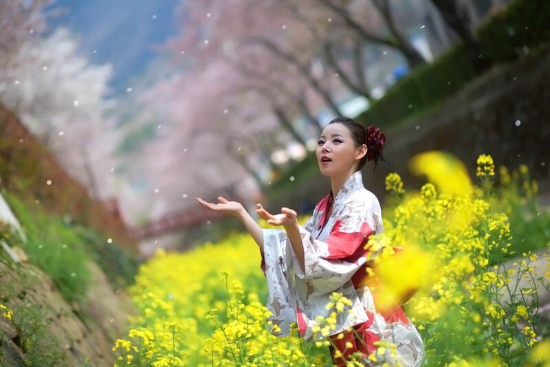 Woman in kimono among flowers