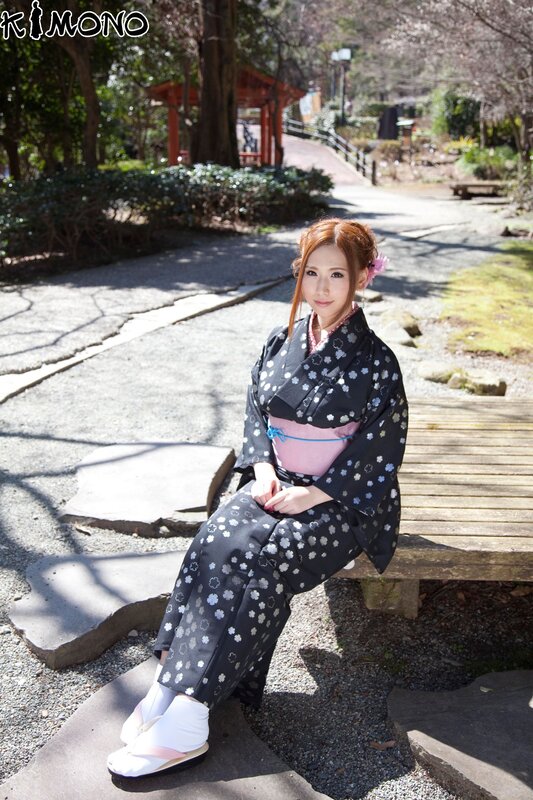 Woman in kimono at park