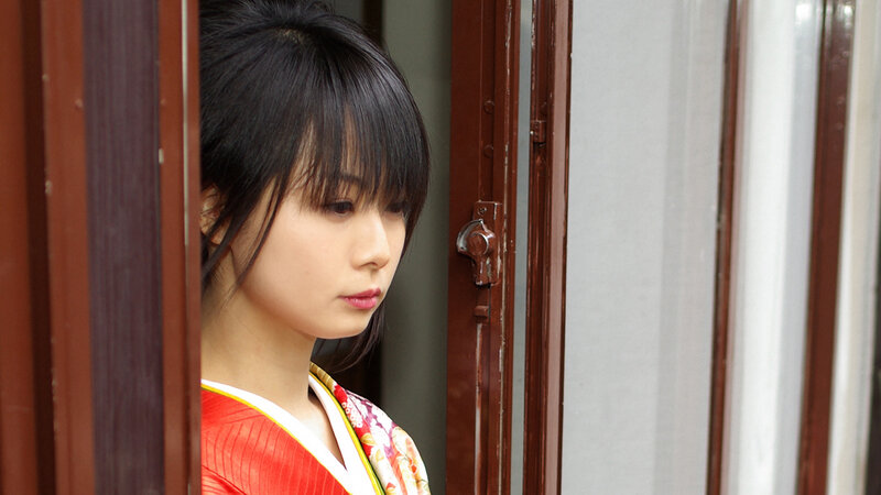 woman in kimono by door