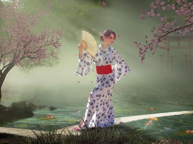 Woman in kimono by pond