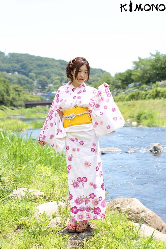 Woman in kimono by river