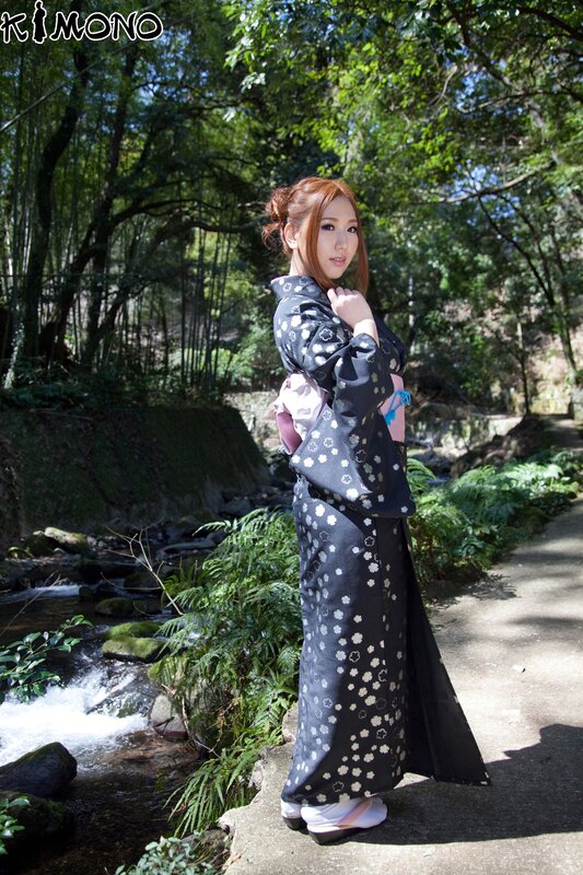 Woman in kimono by stream