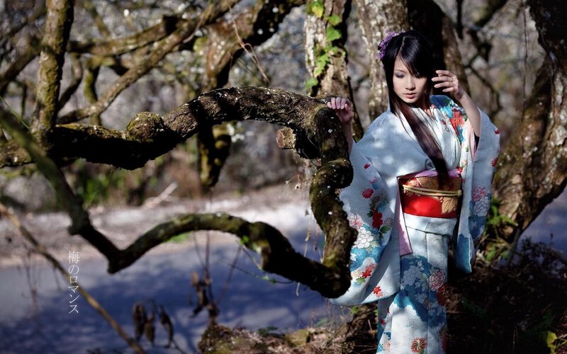 Woman in kimono by tree
