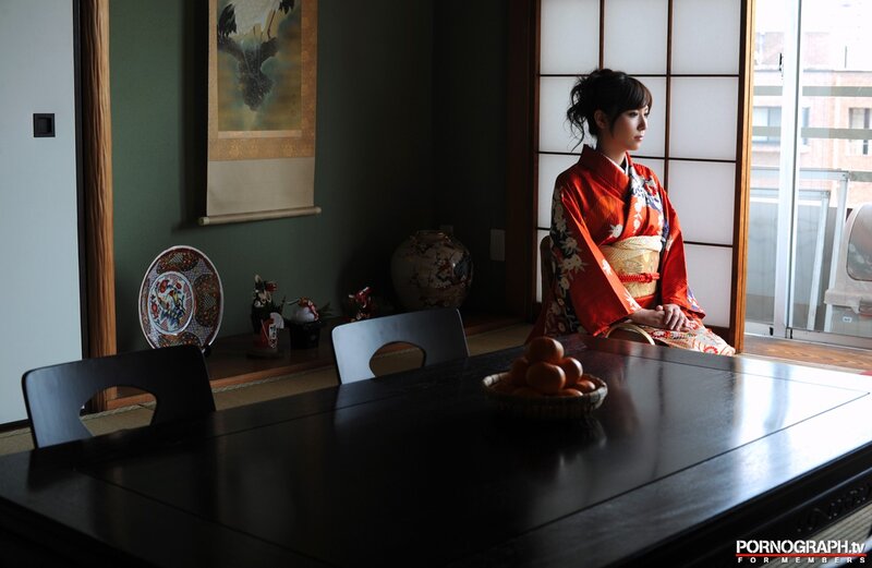 woman in kimono by window