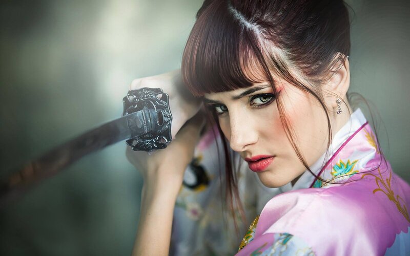 woman in kimono holding katana