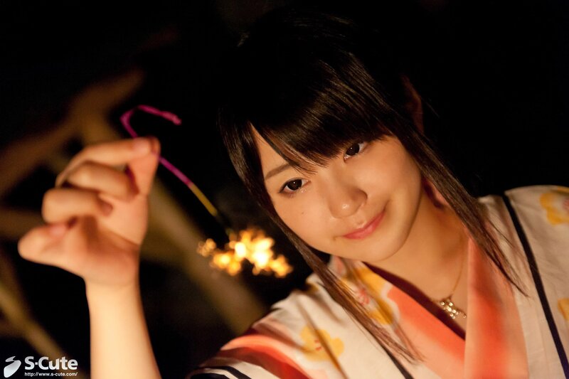 Woman in kimono holding sparkler