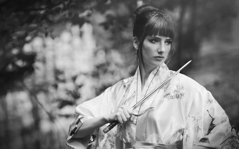 woman in kimono holding weapon