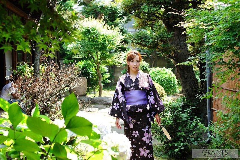 Woman in kimono in garden