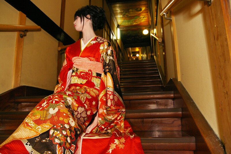 Woman in kimono on staircase